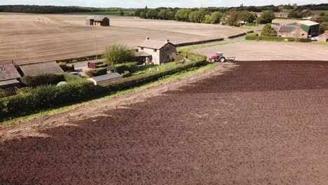 Aerial-footage-over-tractor-ploughing-field