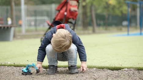 Boy-playing-with-toy-outdoor