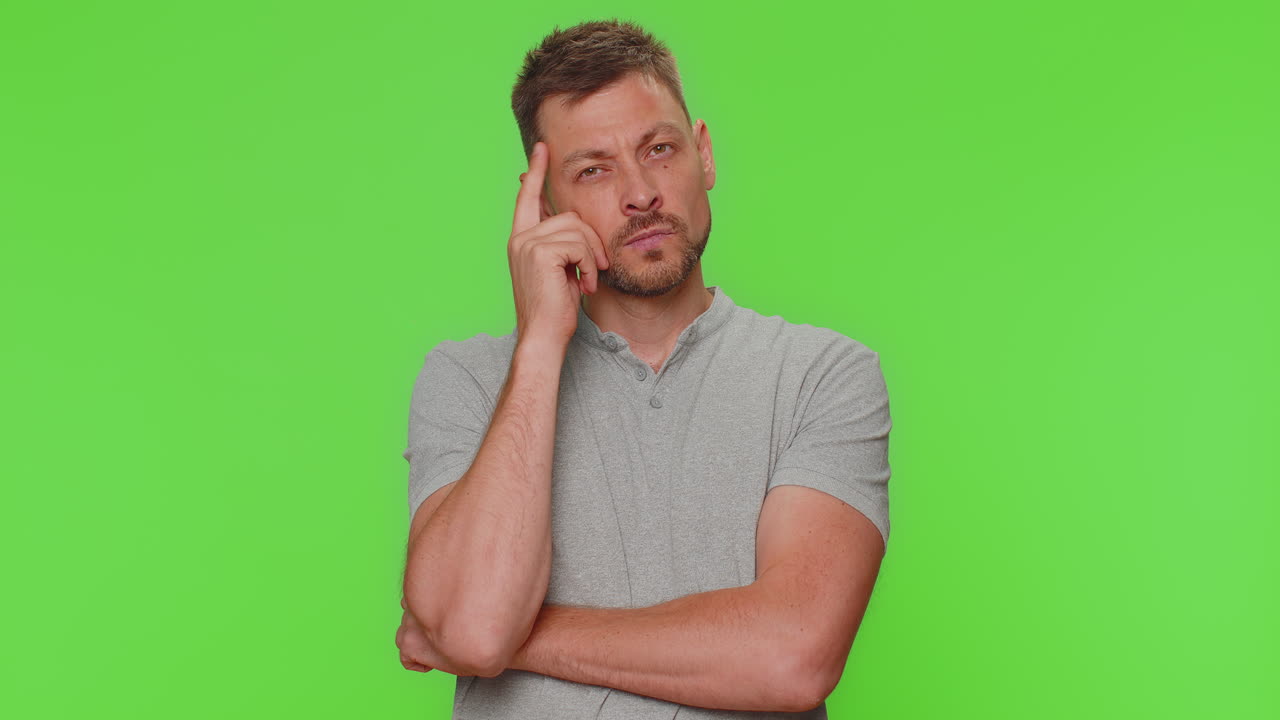 Inspired man pointing finger up with open mouth, having good idea, plan, startup Eureka motivation