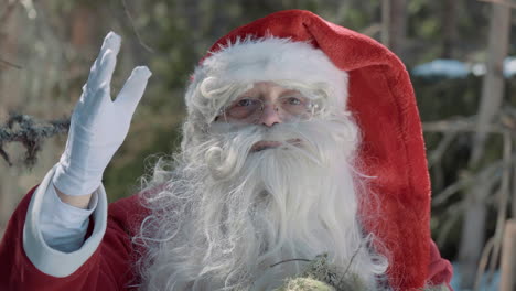 santa talks to the camera and waves