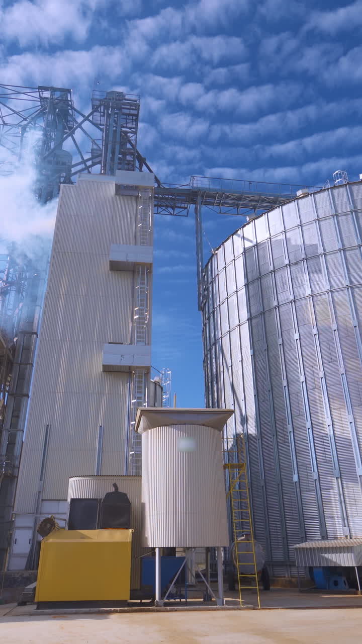 Contemporary factory for agribusiness. Steel elevators for grain ...