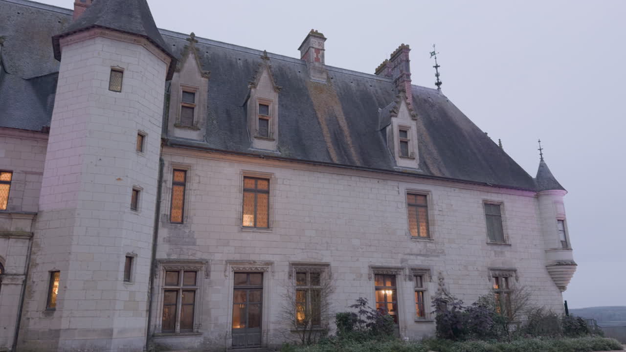 Chaumont-sur-Loire castle facade with Gothic architecture under soft evening light in a peaceful setting