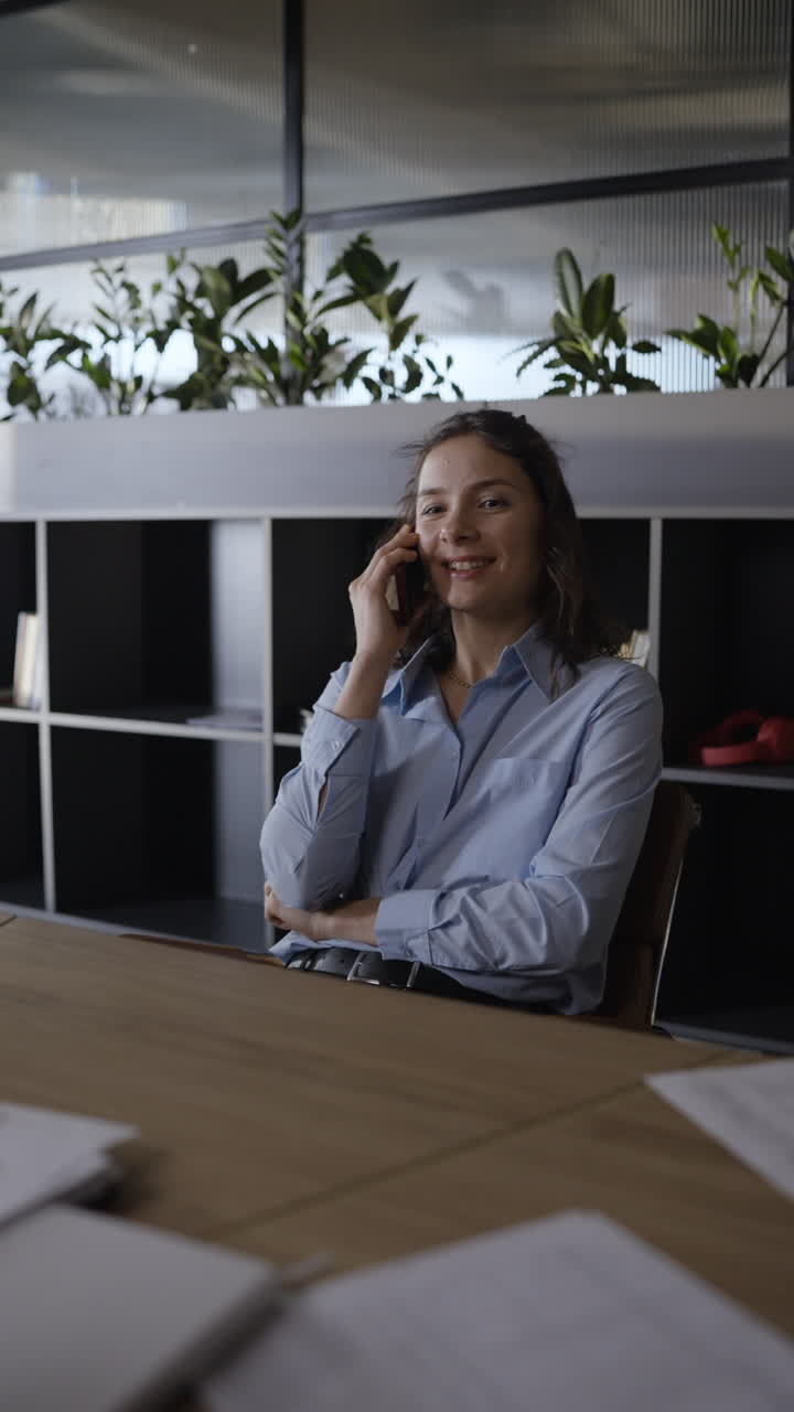 Woman Talking on Phone in Modern Office