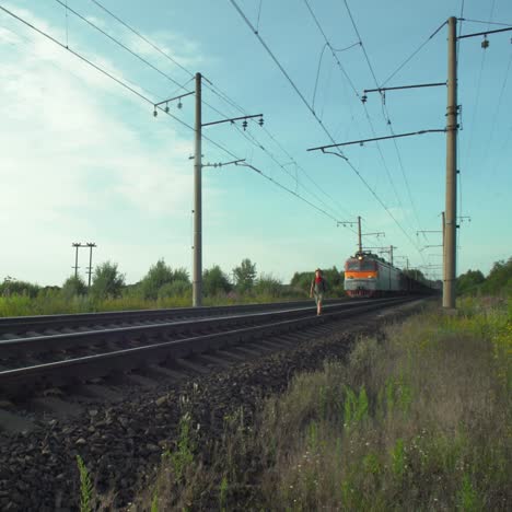 boy walking on railway