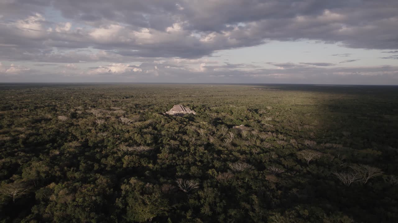 Lush Vegetation And Green Fields Against Cloudy Sky In Chiapas, Mexico - aerial drone shot