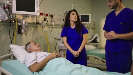 hospital room scene with patient, nurse, and doctor