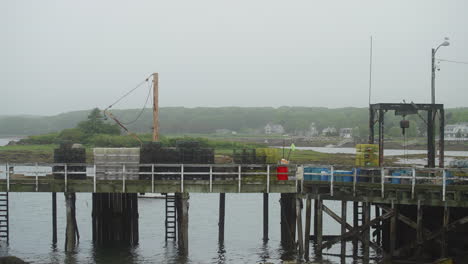 lobster and commercial fishing dock pier with traps and mechanical lift 4k 60p