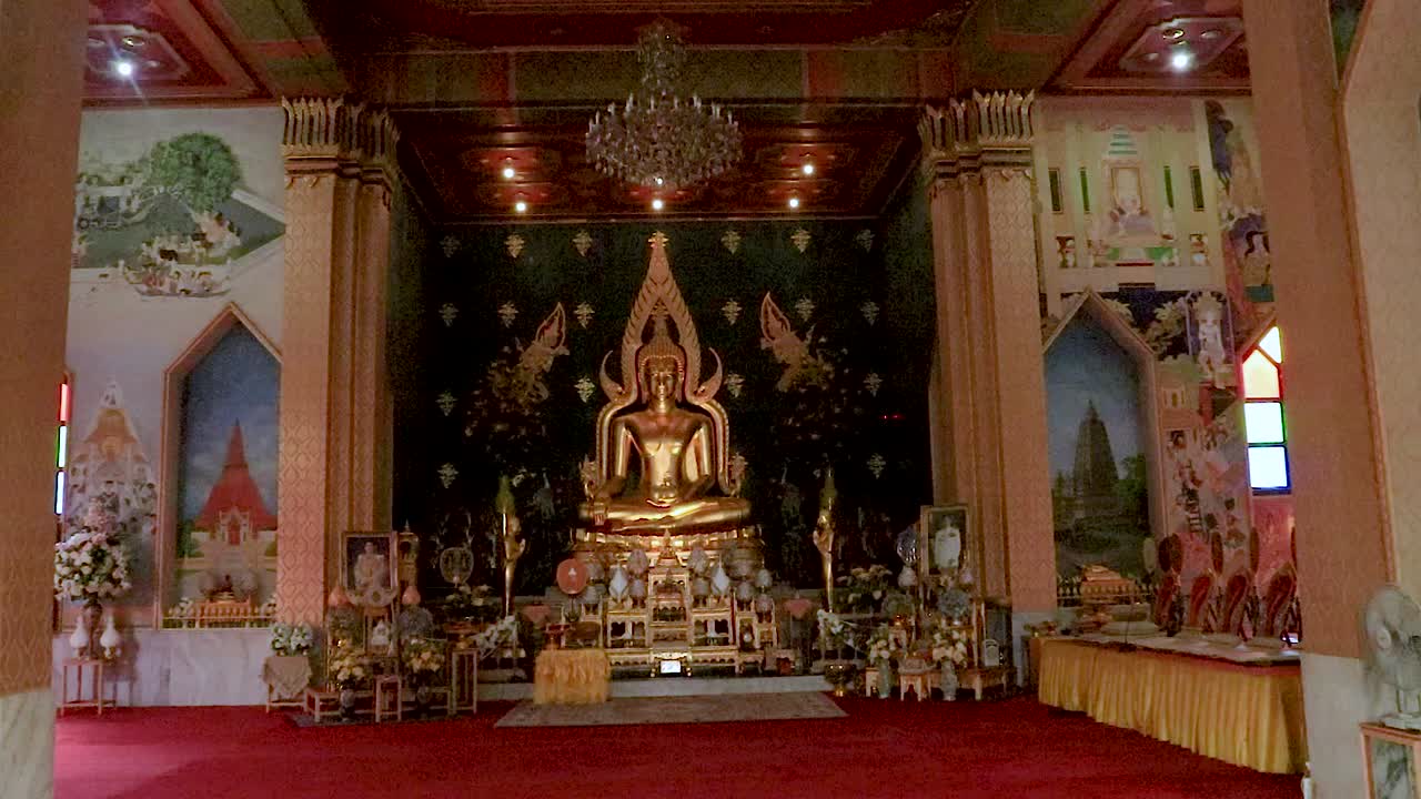 golden buddha statue at monastery from flat angle video taken at thai monastery bodh gaya bihar india on Feb 11 2020.