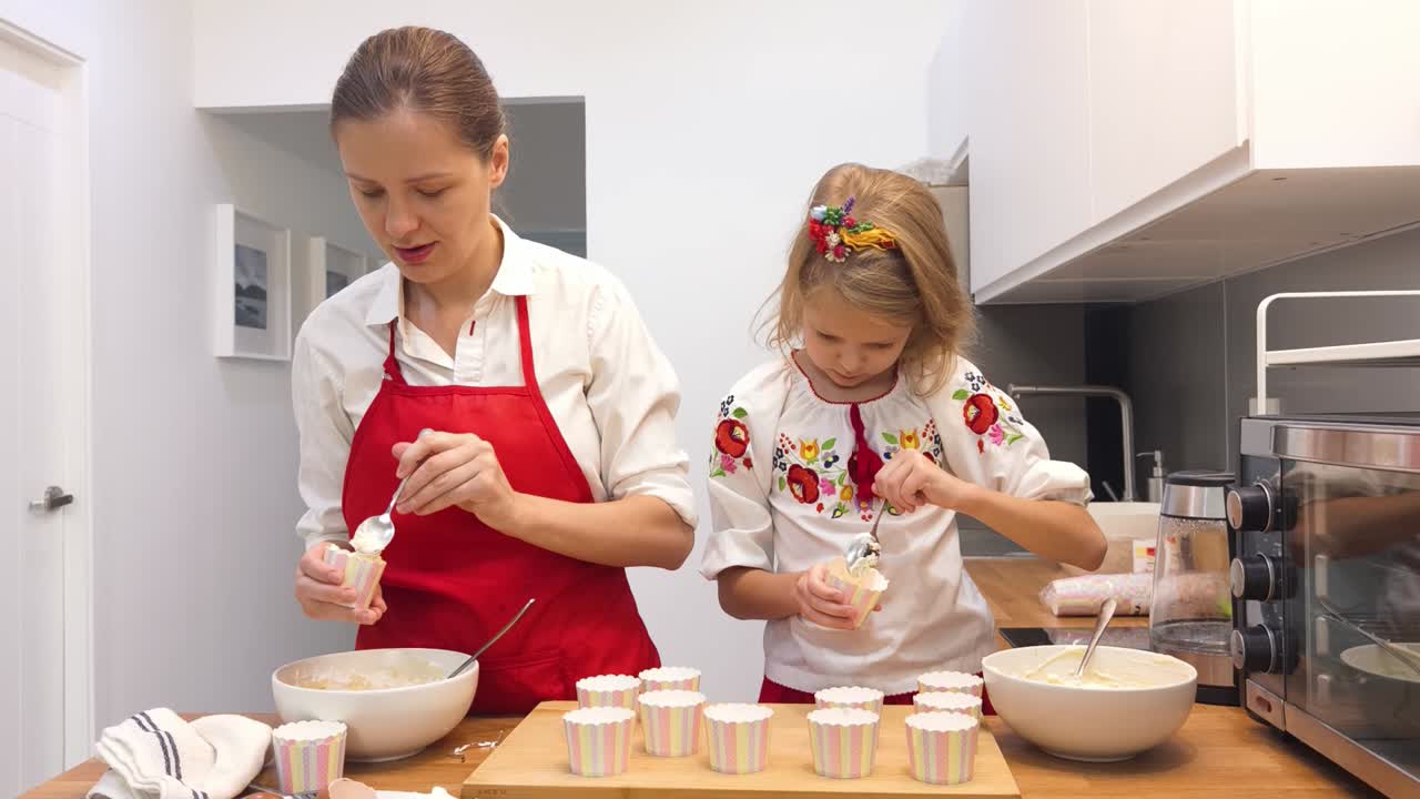 Mother and Daughter Baking Cupcakes