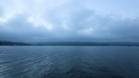 cloudy sky over tranquil island and lake