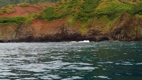 HD-120fps-Hawaii-Kauai-Boating-on-the-ocean-waves-crash-on-rocky-shoreline