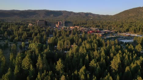 flying towards harrah's lake tahoe hotel and casino in the united states - aerial drone shot