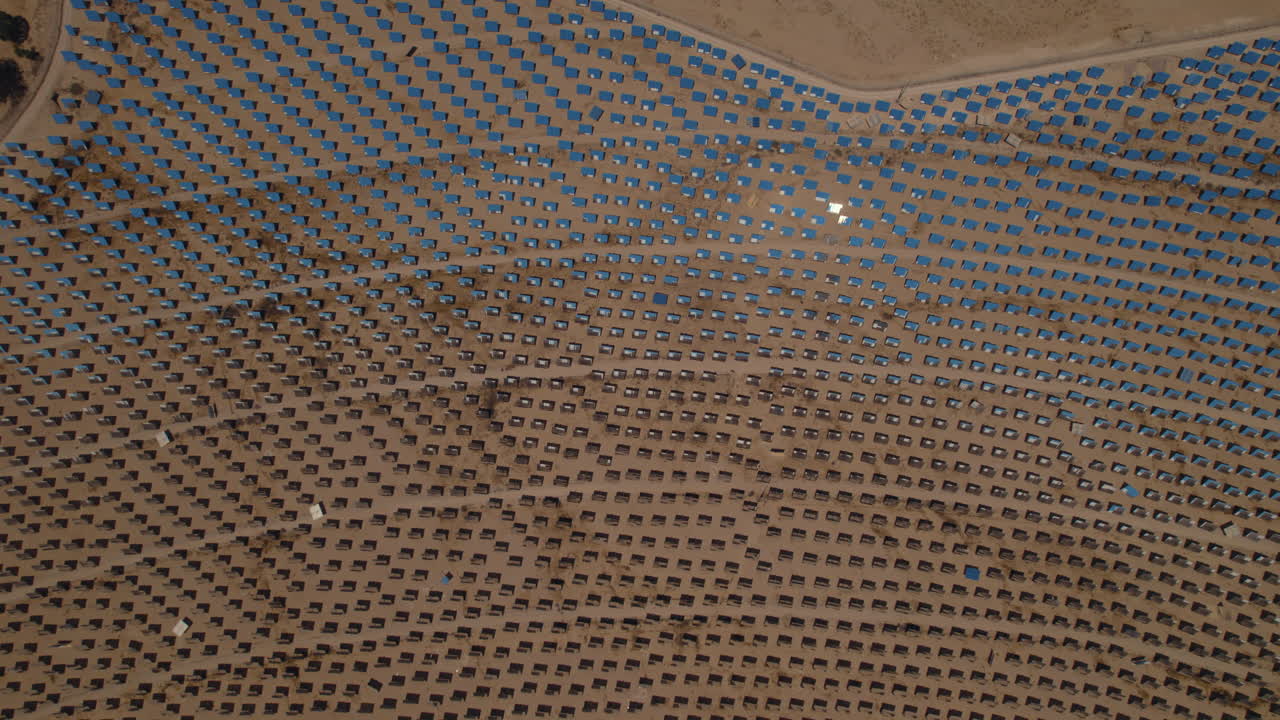 Ashalim power station 50,000 motorized mirrors that track the sun's imaginary motion across the sky to direct it to a fixed point in the solar tower