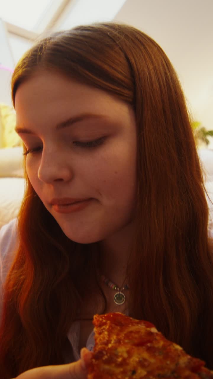 Teenage Girl Eating Pizza