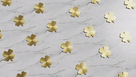 golden four-leaf clover on grey background good luck 3d rendering animation endless loop sales concept lucky shot