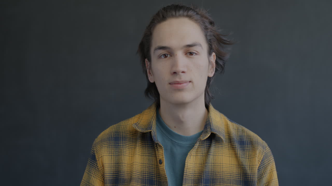 Young Man Smiling and Showing Ok Sign