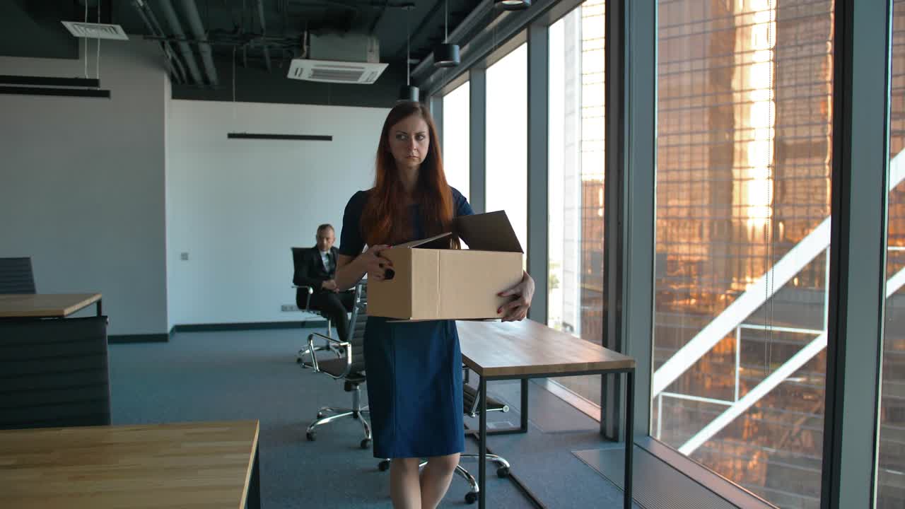 Redhair business woman leave the office after being fired