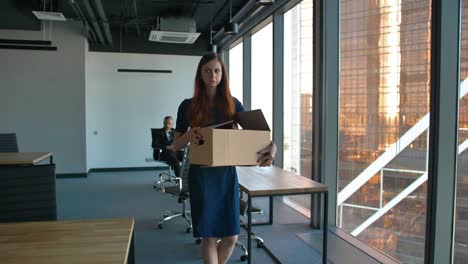 redhair business woman leave the office after being fired