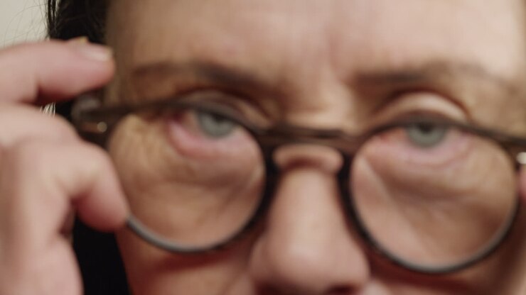 close up eyes wrinkled old woman wearing glasses aging beauty healthy eyesight concept