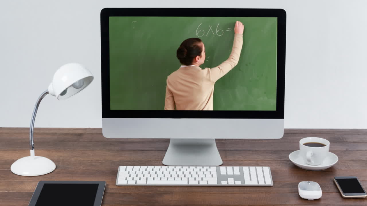 Animation of a computer monitor showing Caucasian female teacher on the screen