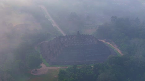 aerial view of iconic temple building in foggy weather