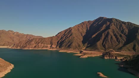 aerial establishing shot of the stunning mountain range in mendoza, argentina