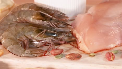 a selection of shrimp, chicken, nuts, and eggs arranged for culinary inspiration.