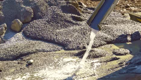 close-up of water and concrete from the concrete mixer