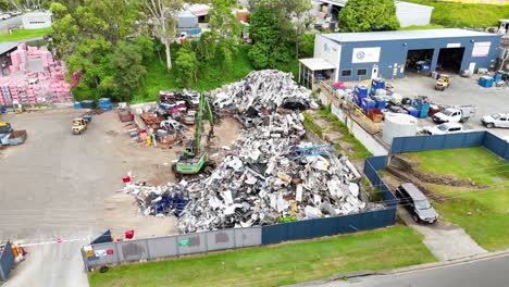 aerial view of scrapyard machinery moving metal