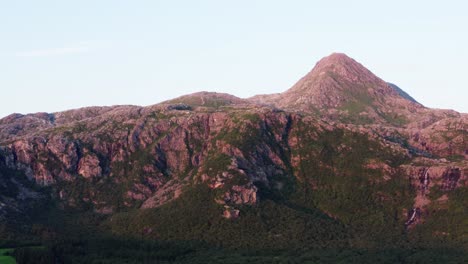 Beautiful-red-mountains-of-Dønnamannen-in-Norway-at-sunset--Aerial