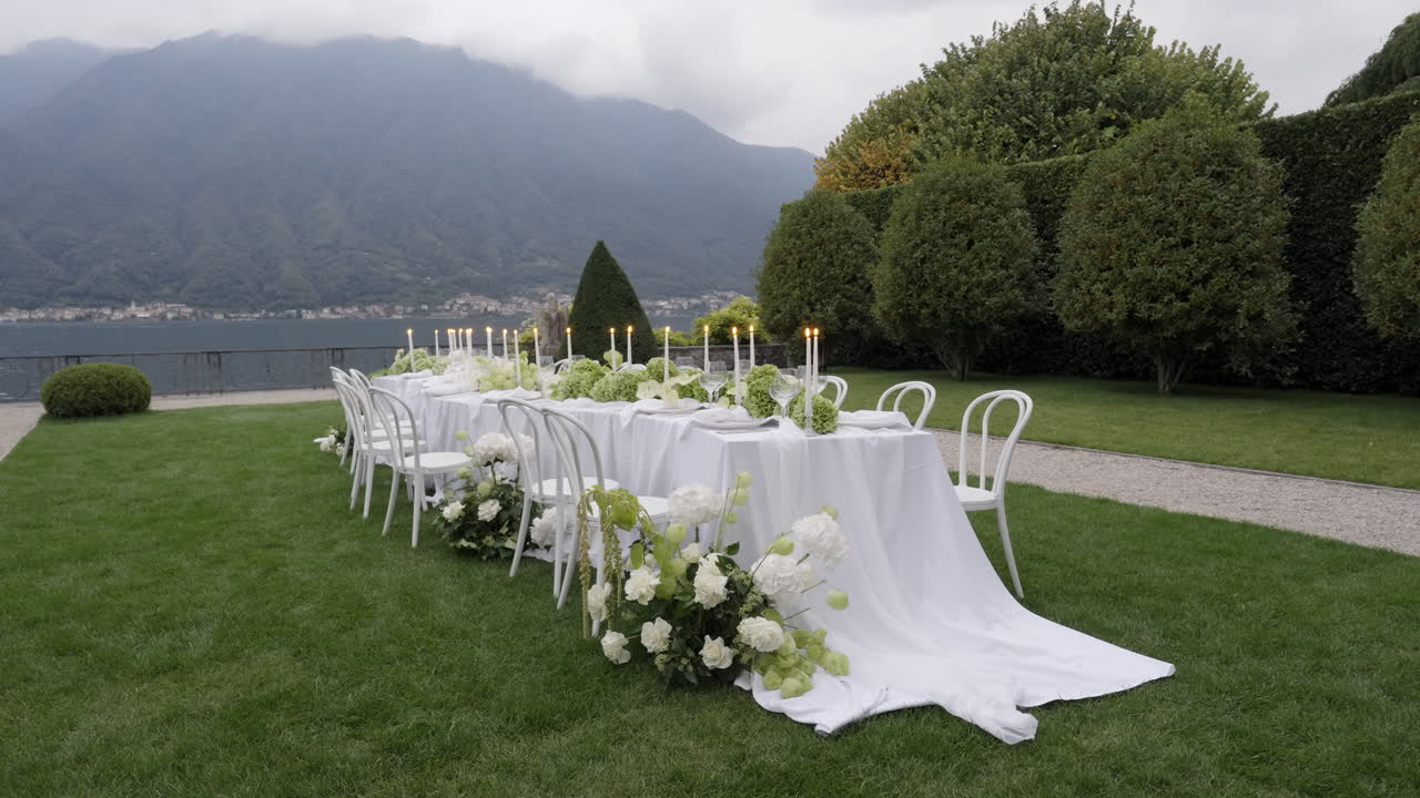 Elegant Outdoor Wedding Reception with Lake and Mountain Views