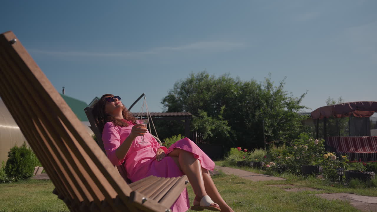 Relaxing Garden Moment, Sunlit Woman Peacefully Enjoying Garden Surroundings, Serene Scene Of Woman Relaxing Amidst Greenhouse Flora, Calm And Tranquil Summer Day With Woman Enjoying Garden Ambiance