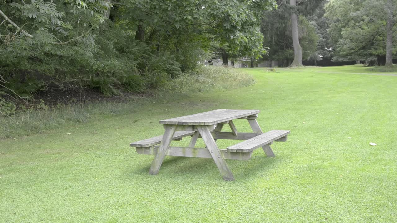 An empty picnic table in a park in Scotland
