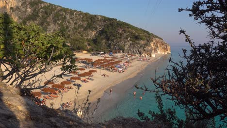 beautiful view out on gjipe beach in albania at sunset - hidden beach