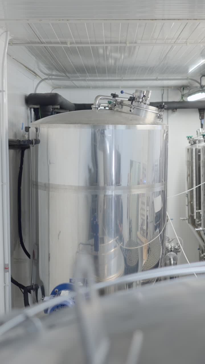 Large Stainless Steel Tank in an Industrial Processing Facility