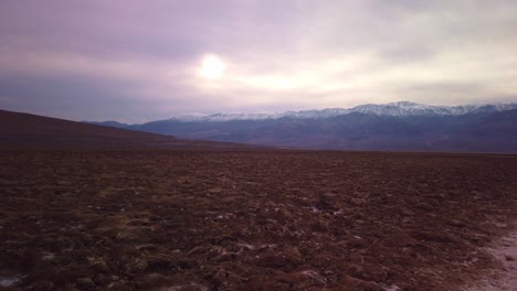 gimbal booming down shot of the badwater basin salt flats in death valley, california