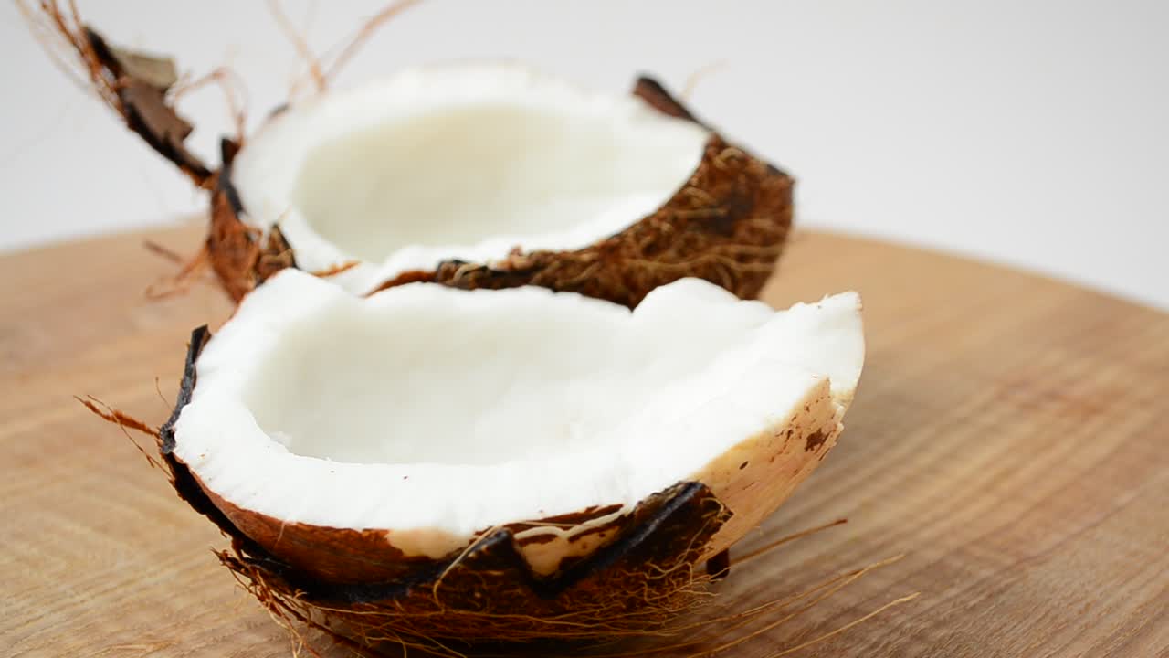 Shooting of coconut. Coco in a section, juice