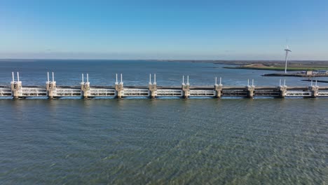 aerial shot of the eastern scheldt storm surge barrier in zeeland, the netherlands, on a beautiful sunny day