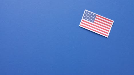 National-flag-of-usa-lying-on-blue-background-with-copy-space