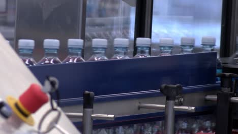 New-plastic-bottles-on-the-conveyor-belt-of-a-drinking-water-plant