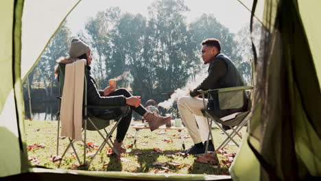 couple, camping and talk by tent