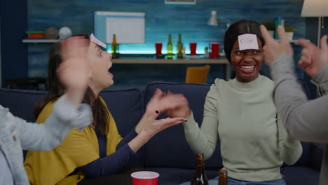 group of multi-ethnic people having fun while playing board game