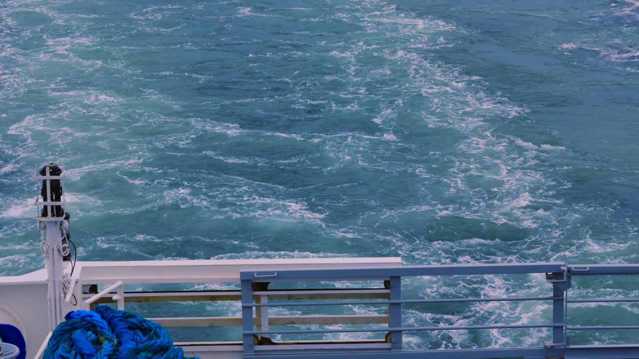 Rearview of Ferry with Propellers Creating Wake on Calm Sea with Barrier. Holiday, Vacation Concept 4K