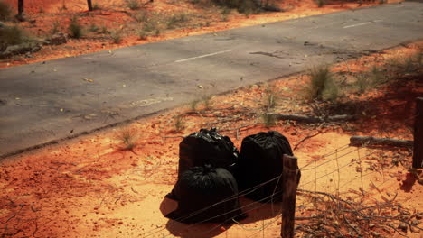 closeup-of-full-trash-bags-on-the-sand