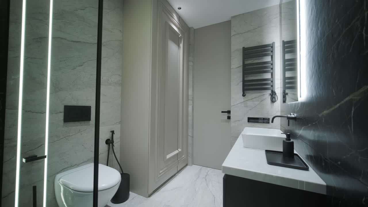 Contemporary Bathroom with Marble Accents and Vertical Lighting