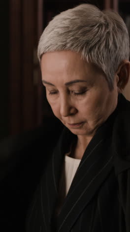 senior woman in a black coat