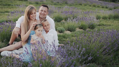 portrait of a young happy family with two small children