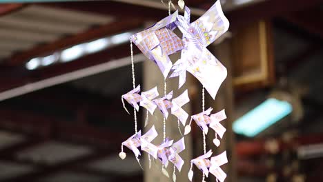 colorful paper ornament swaying gently indoors