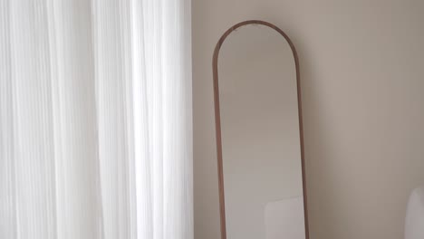 modern arched mirror with wooden frame