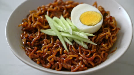 korean instant noodle with black bean sauce topped cucumber and boiled egg - korean food style